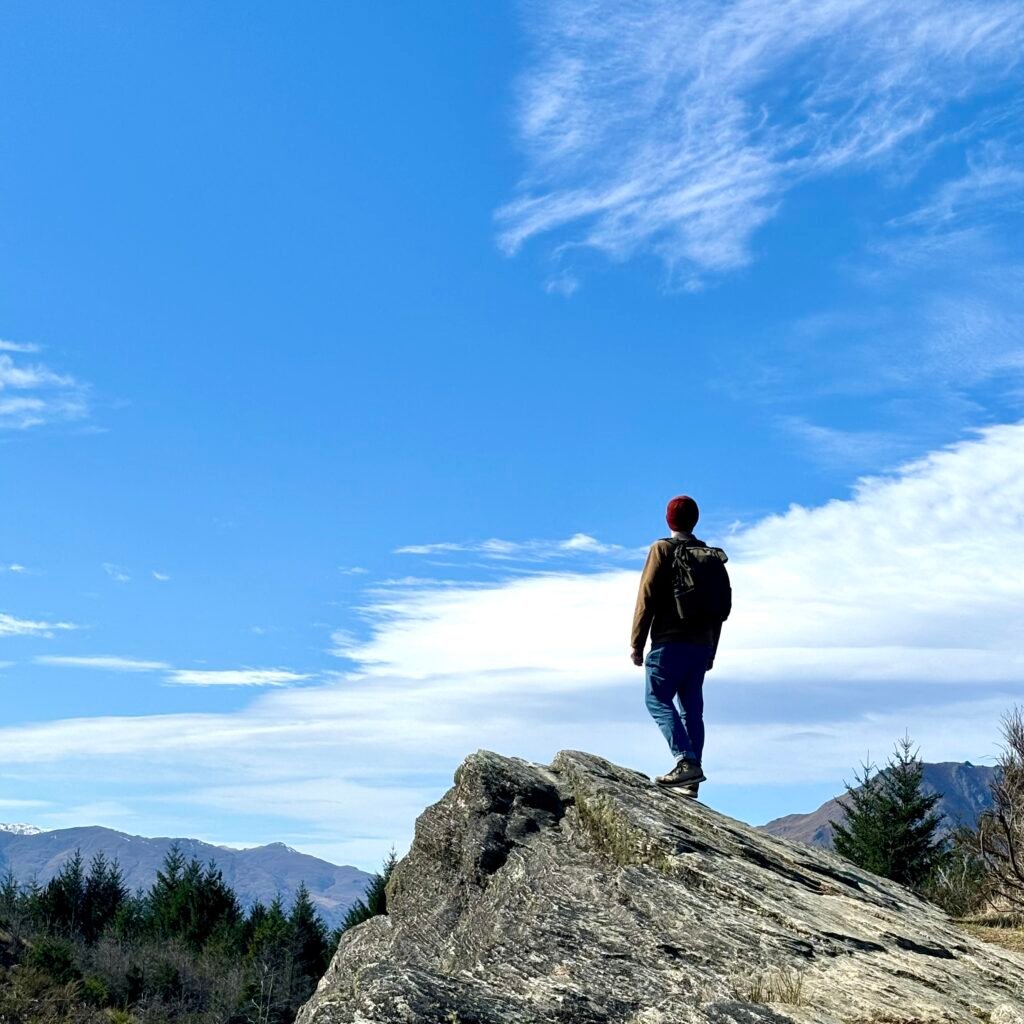 Man overlooking Queenstown.